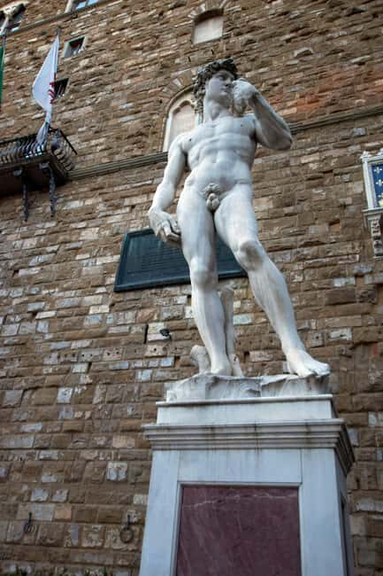 Express Florence and Medici Chapel and Michelangelo Tour - Loggia dei Lanzi, the market energy, and the Fountain of the Boar