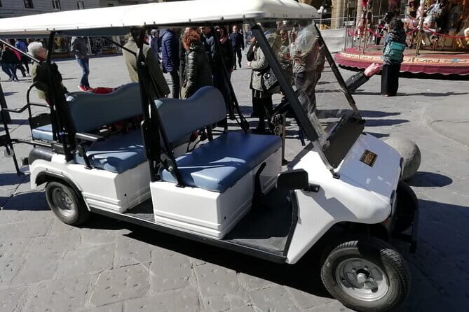 Florence Tour by Eco Car with Panoramic View - Your guide, earphones, and the pace on steep, curvy hills