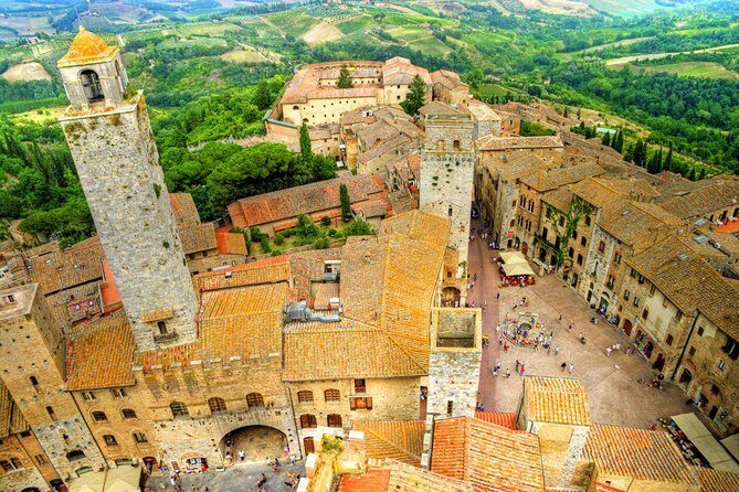Half Day Tour Chianti Winery with San Gimignano - San Gimignano at Piazza Della Cisterna: Towers, Vernaccia, and a Tight Clock